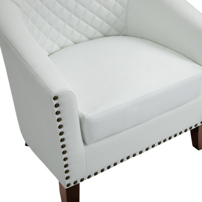 Fauteuil demi-tonneau capitonné en similicuir Edvardas