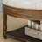 Large round ottoman coffee table in light grey, 2-tier design with button tufted top & wood storage shelf
