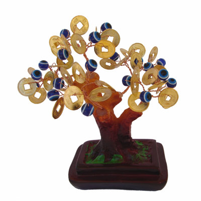Arbre d'argent avec sculpture de mauvais yeux