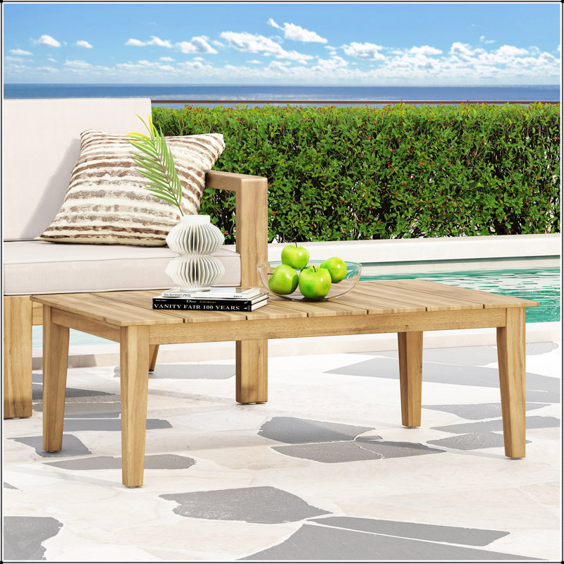 Table basse d'extérieur en bois d'acacia durable avec un design rustique et une finition résistante aux intempéries, parfaite pour le patio et le jardin