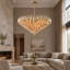 Lustre à 12 lumières étagées de 94 cm (37 po), doré
