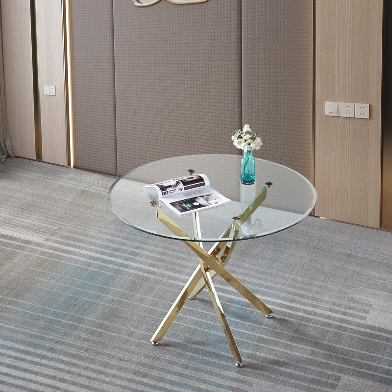 Table de salle à manger ronde contemporaine en verre trempé transparent avec pieds en acier inoxydable à finition dorée