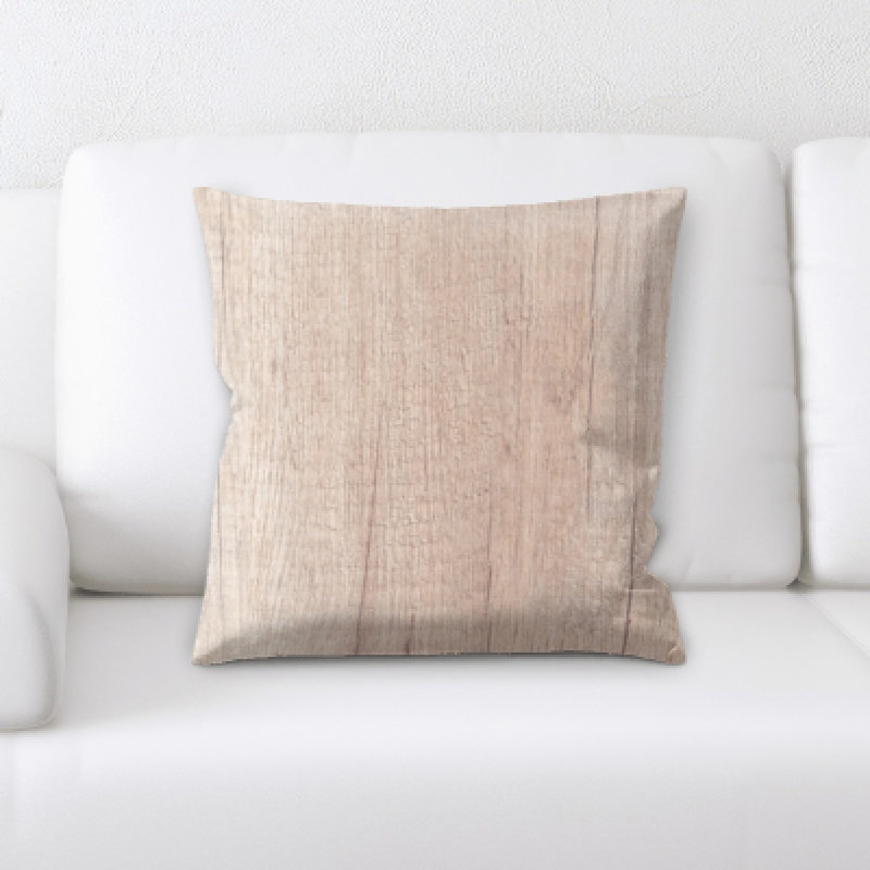 Coussin décoratif de feuilles sur un fond en bois Archibald