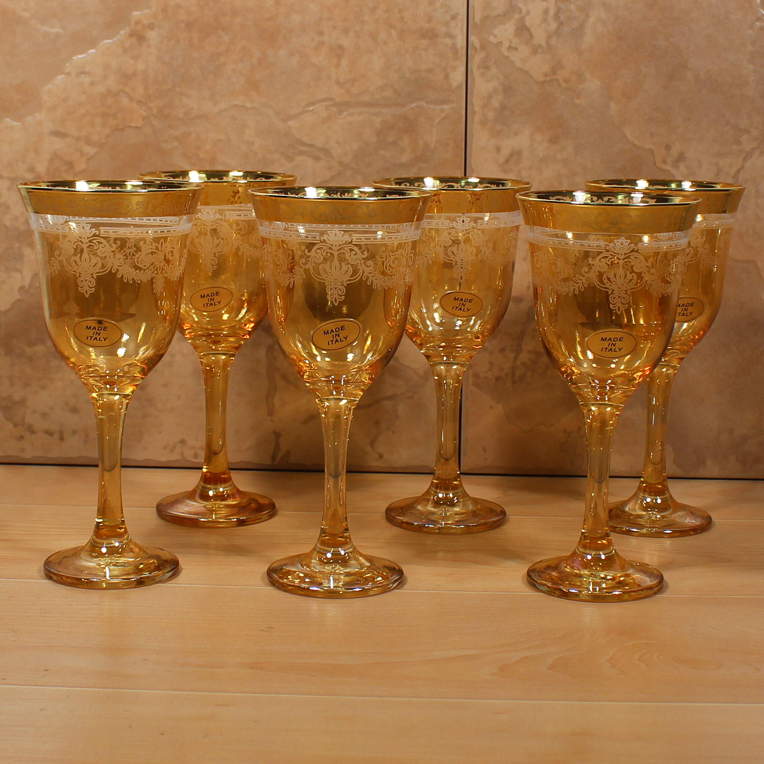 https://assets.wfcdn.com/im/38217517/compr-r85/3016/30160056/lorren-home-trends-veneziano-6-piece-9oz-glass-goblet-stemware-set.jpg