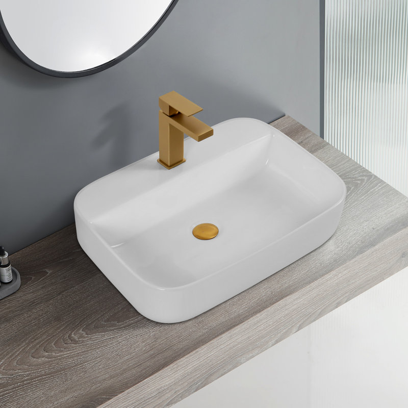 Lavabo de comptoir de salle de bain en céramique - blanc, avec une surface lisse et brillante blanchie convenant à diverses configurations