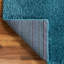 Tapis en polypropylène tissé à la machine à poils longs de couleur unie turquoise Fragos-1063882287