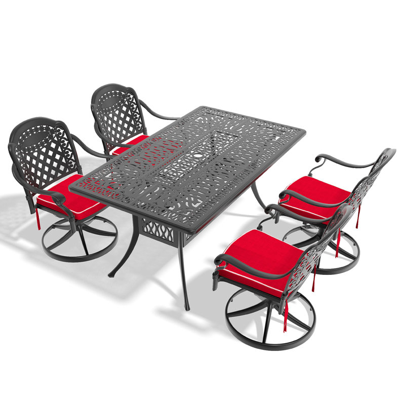 L'ensemble de salle à manger toutes saisons en fonte d'aluminium comprend 4 chaises pivotantes et une table rectangulaire avec cadre noir 