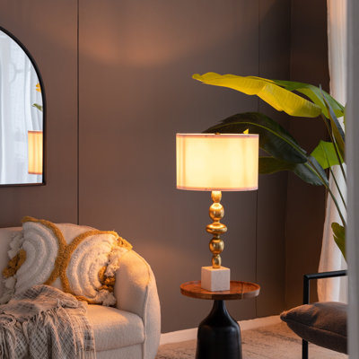 Lampe de table avec corps rond à quatre niveaux