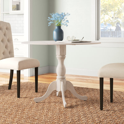 Arishka Extendable Round Solid Wood Dining Table