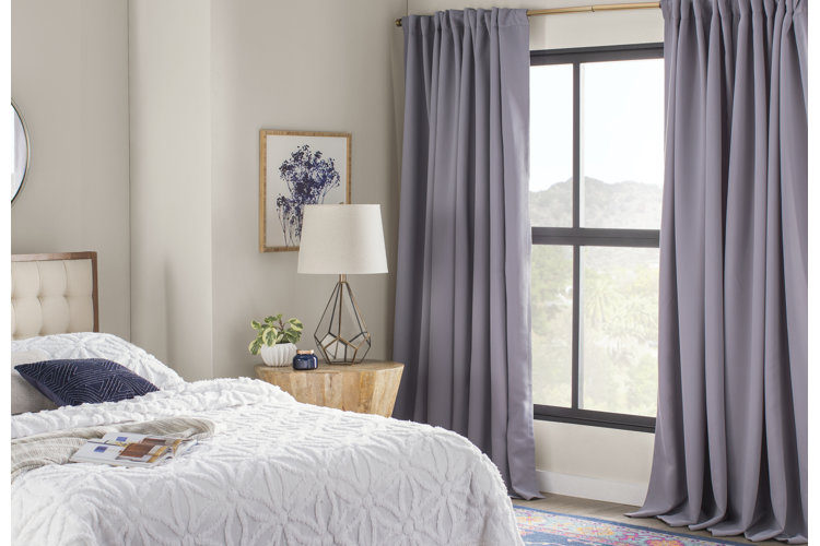 gray room-darkening curtains in a modern-style bedroom window