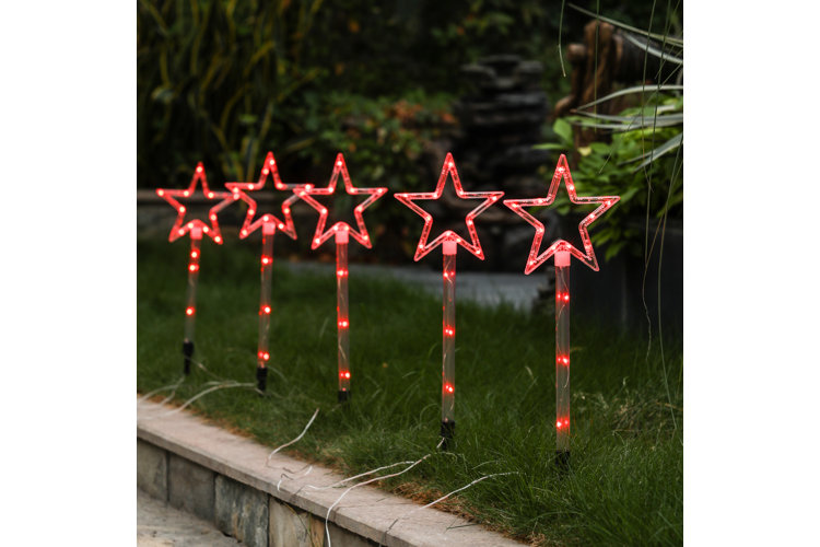 row of festive star path lights