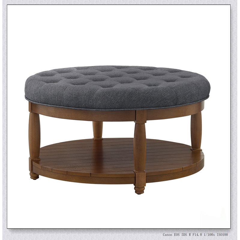 Grande table basse ronde avec repose-pieds rembourré en lin capitonné, parfaite pour une utilisation intérieure et extérieure avec tablette en bois massif