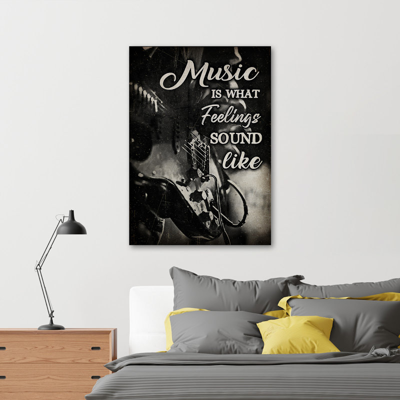 «Guitare sur fond noir - Music Is What Feelings Sound Like», reproduction d'art graphique sur toile tendue