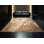 Tapis oriental doux et moelleux à motif de pages de livres en brun et beige