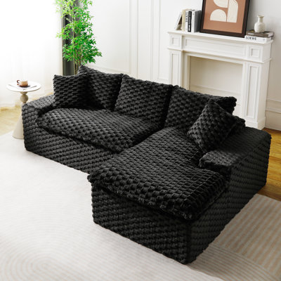 “Black Waffle Knit Sectional Sofa – Stylish Modular Living Room Seating”