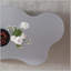 Table basse en acier inoxydable avec une silhouette en forme de couronne