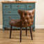 Fauteuil demi-tonneau capitonné à dossier capitonné