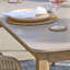 Geraldo 6 - Person Acacia Solid Wood Patio Dining Set Rectangular Table with Cushions Included