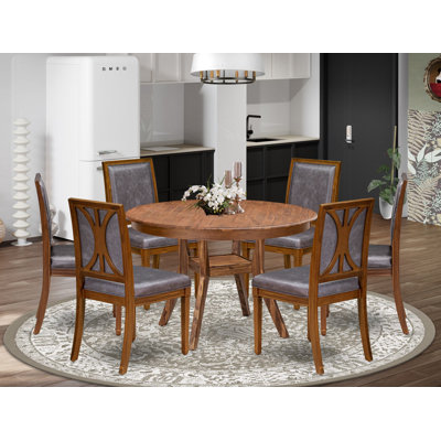 Cet ensemble de salle à manger 7 pièces comprend une table ronde et 6 chaises en similicuir gris foncé à dossier haut, finition noyer antique.