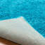Tapis turquoise tissé à la machine Deatherage-662684090