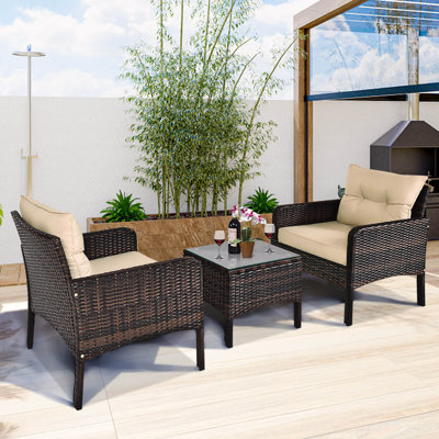 Ensemble de 3 meubles de patio en osier avec coussins et table basse en verre trempé brun