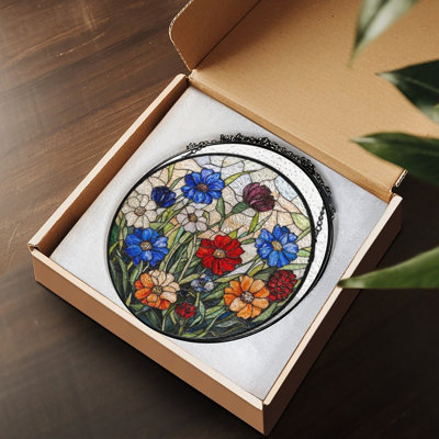 Motif floral coloré en vitrail avec panneaux de vitrail bleu