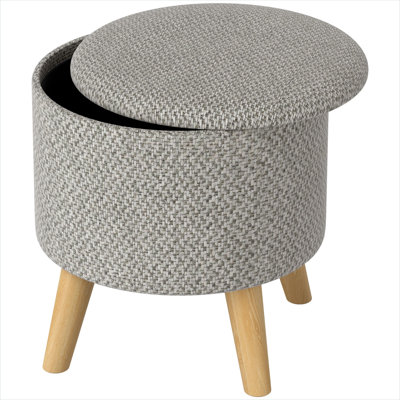 Oak-legged round storage ottoman with neutral gray linen seat and hidden compartment