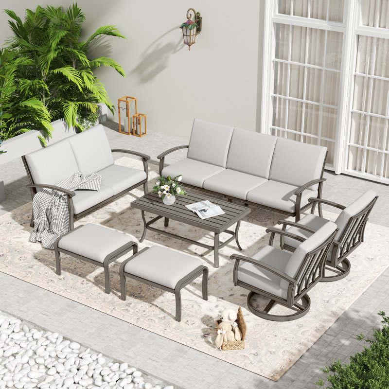 7-Piece Aluminum Patio Conversation Set With Coffee Table, End Table, Ottomans And Light Gray Cushions