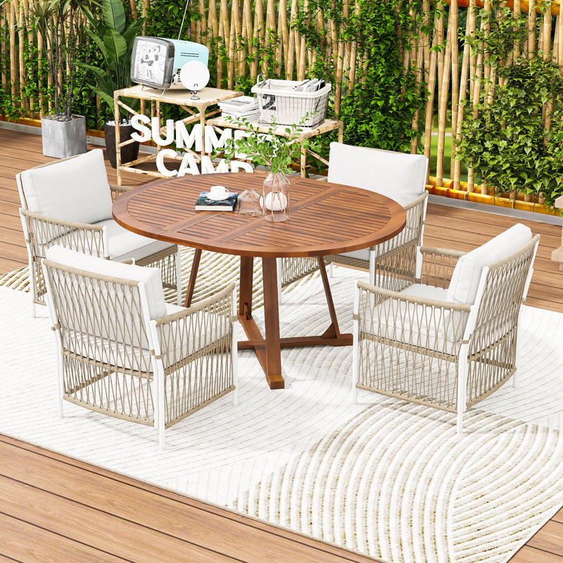 5-Piece Extendable Patio Dining Set with a Butterfly Leaf Round Table and 4 Rattan Cushioned Armchairs