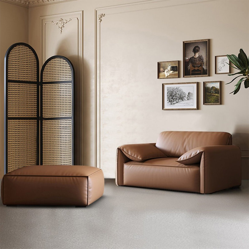 Chaise avec accoudoirs et coussin en cuir brun brun avec repose-pieds