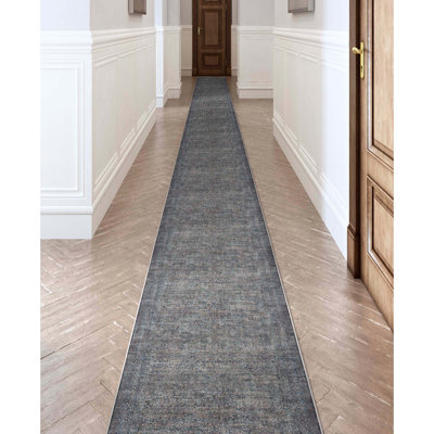 Tapis oriental bleu tissé à la machine