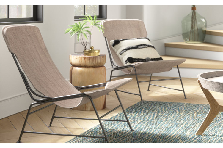 modern side chairs with an end table and a vase full of greenery