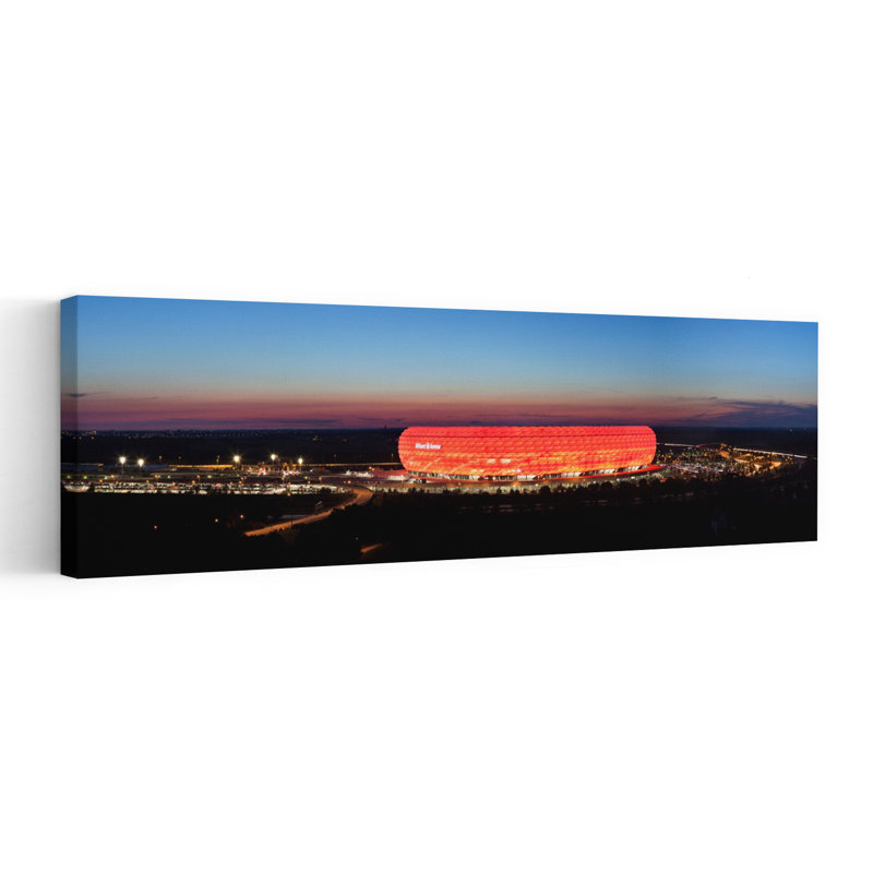 Soccer Stadium Lit Up At Dusk Allianz Arena Munich Bavaria Germany by Markus Lange - Wrapped Canvas Panoramic Print