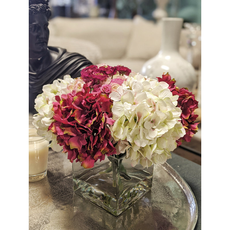 Assorted Hydrangeas And Ranunculus In Square Glass Vase