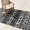 Tapis d'extérieur en paille de plastique imperméable pour terrasse Johppah noir et blanc