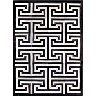 Area Cowhide Geometric Area Rug in Black/Cream