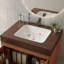 Meuble-lavabo autoportant de style Mid-Century avec comptoir en faux marbre et lavabo en céramique, armoire de rangement à double porte, bois d'ingénierie imperméable, pieds dorés-30493960