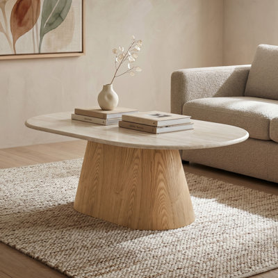Table basse ovale Soulière en pierre frittée avec piètement en frêne