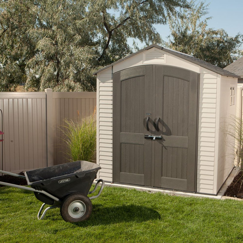 Tan and Brown Polyethylene Outdoor Storage Shed with Shelving and Windows