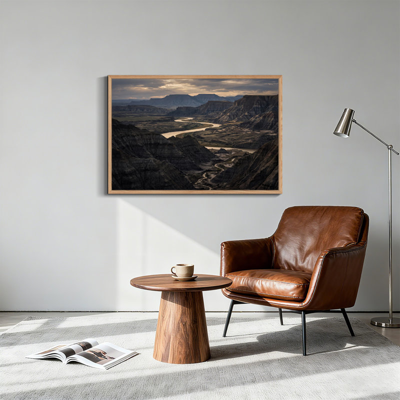 «Winding River Through Rugged Badlands Under Cloudy Sky», art mural, 32"H x 48"W