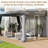 12 ft. W x 10 ft. D Wall-mounted Galvanized Steel Hardtop Gazebo, Heavy-duty Wooden Frame Patio Gazebo with Netting & Curtains-95198002