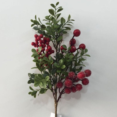 Baies rouges et verdure choisir de fausses plantes et des arbres