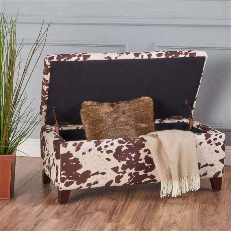 Repose-pieds de rangement polyvalent avec couvercle à fermeture en douceur, grand compartiment intérieur et revêtement en velours luxueux pour les espaces de vie modernes.