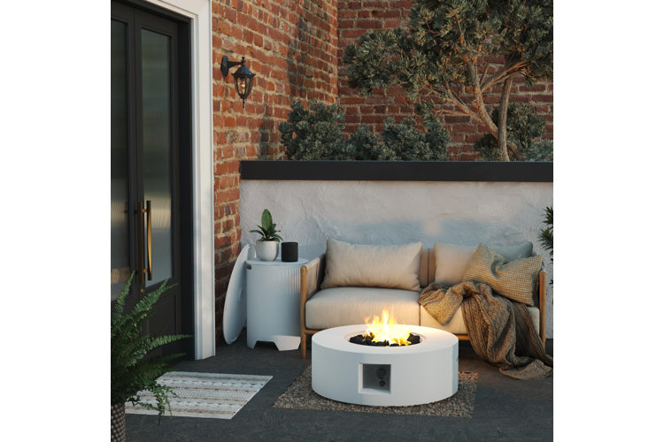 fire pit with outdoor sectional beside it