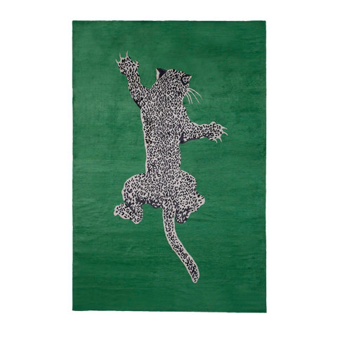 Green rug with a leopard design