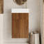 Meuble-lavabo suspendu de 42 cm (16,5 pouces) avec lavabo en céramique, porte et bonde réglable, idéal pour les petits espaces. Style moderne du milieu du siècle, rangement intégré, fermeture amortie.