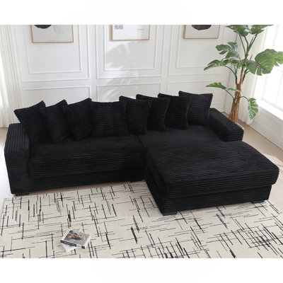 Canapé confortable surdimensionné en velours côtelé avec plusieurs coussins pour une détente ultime et un style moderne