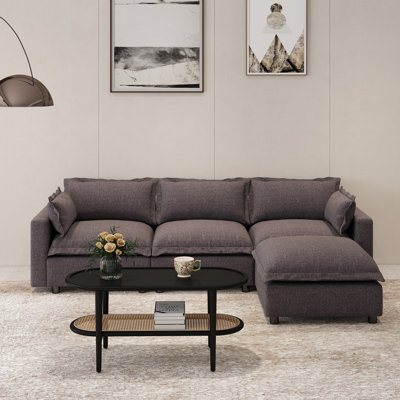 Canapé rembourré avec table basse et repose-pieds