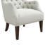 Fauteuil à oreilles capitonné