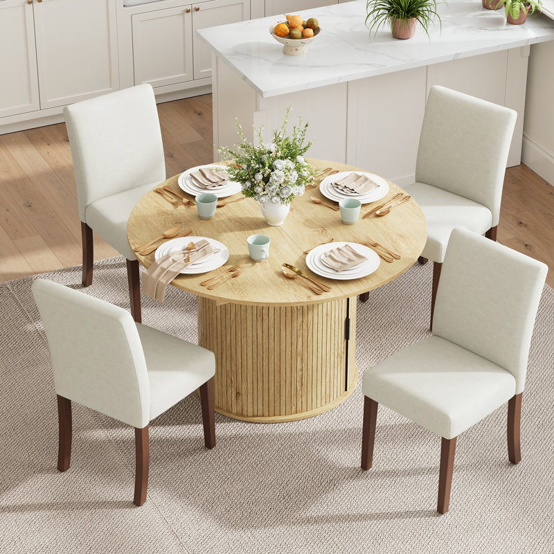 Ensemble de table et de chaises de salle à manger extensibles modernes pour 4 à 8 personnes avec rangement dissimulé, table convertible ronde en ovale et chaises de salle à manger en tissu rembourrées.